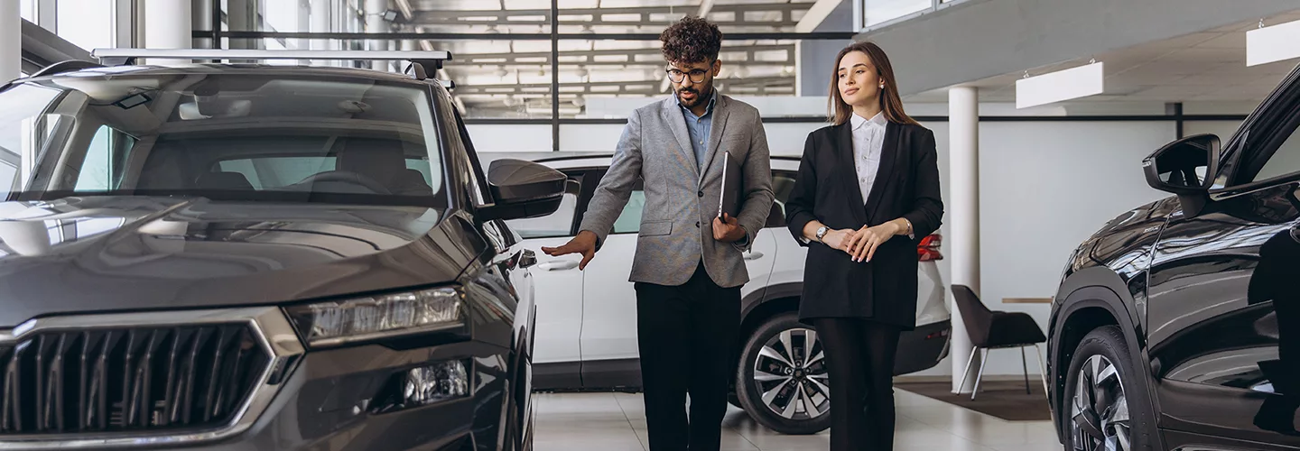 Sales person showing customer around the showroom