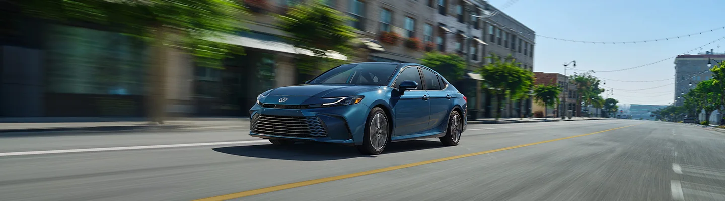 2025 Toyota Camry driving in a city