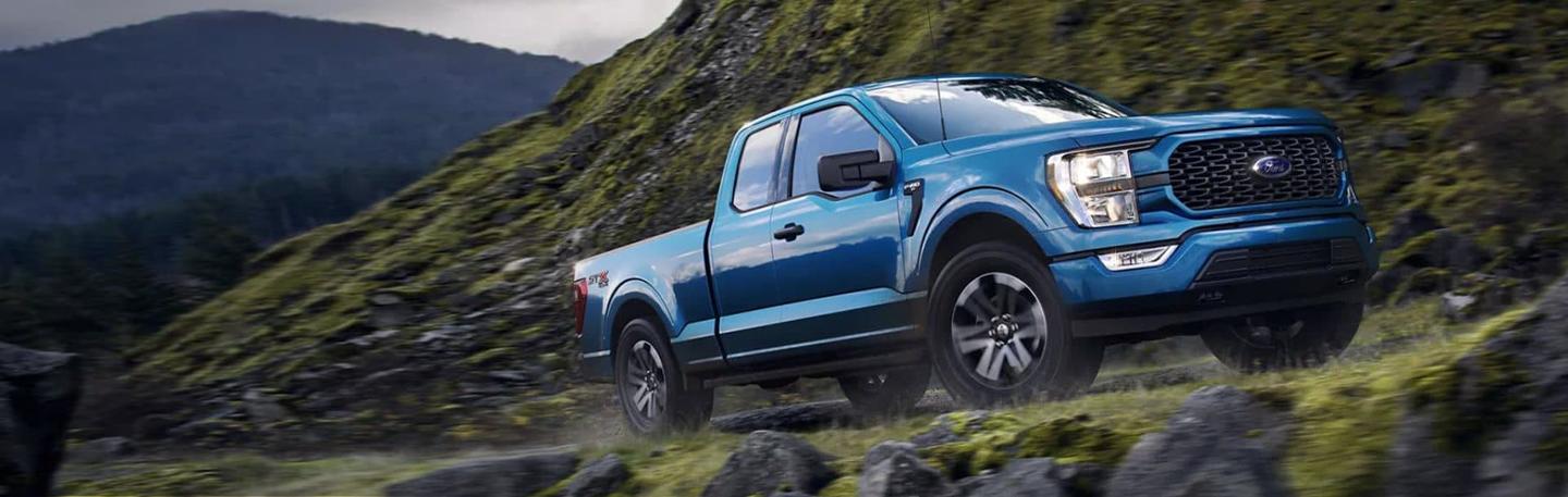 Ford F-150 driving on a dirt road