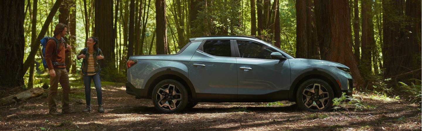2022 Hyundai Santa Cruz SE parked in forest at camping trip