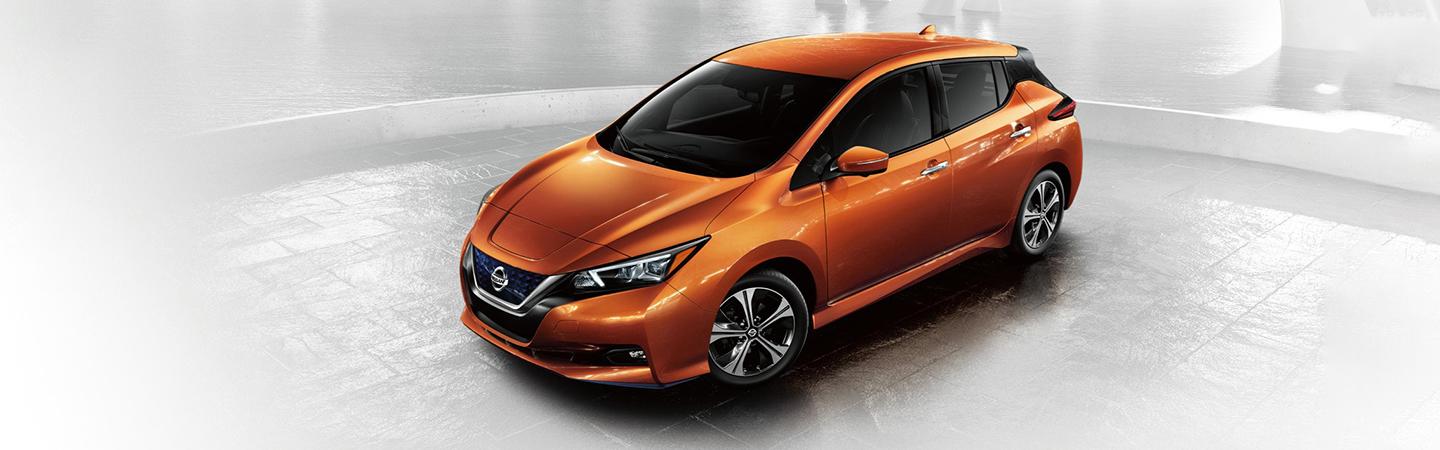 Orange 2022 Nissan Leaf parked
