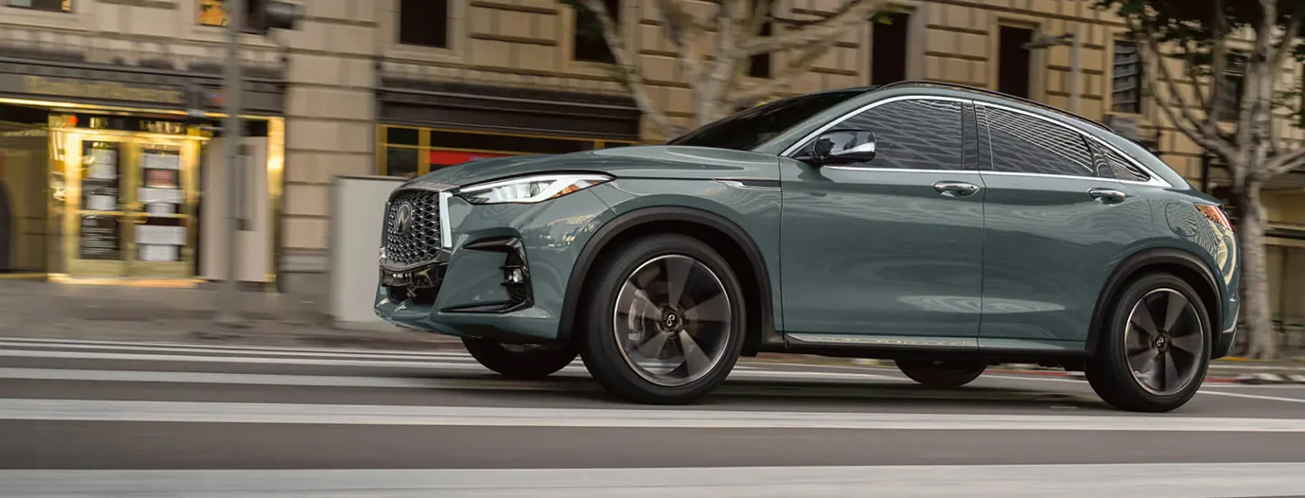 INFINITI QX55 driving down road