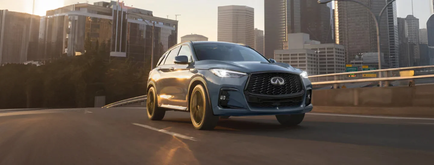 INFINITI QX50 driving down road