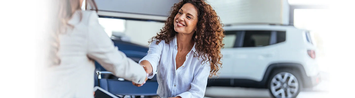 Customer shaking sales persons hand