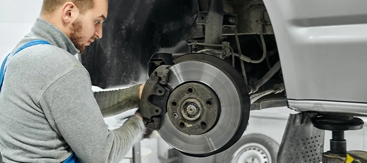 Service tech changing brakes