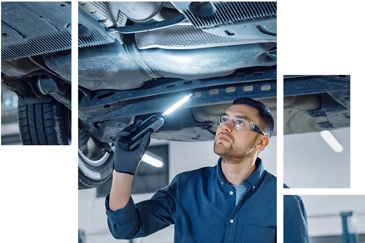Service tech checking under a car for problems