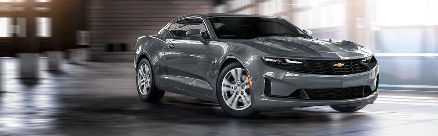 Gray 2022 Chevy Camaro in motion turning on curve