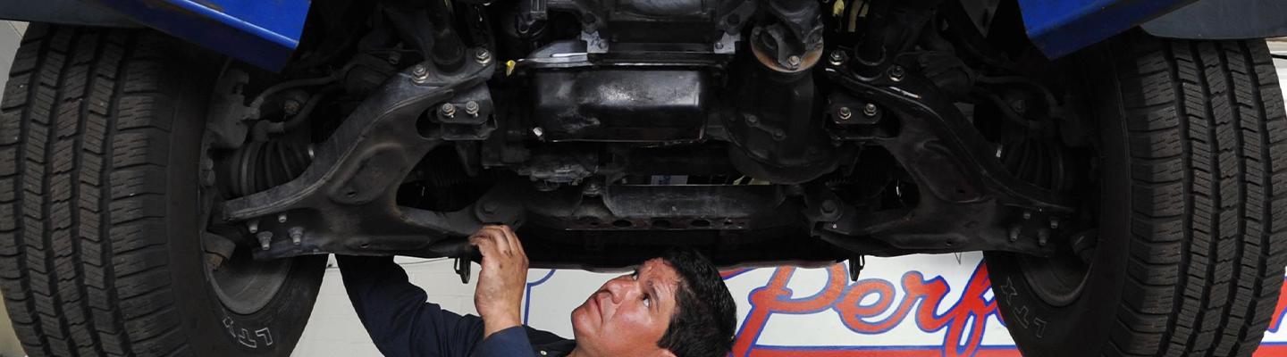 tech under a car