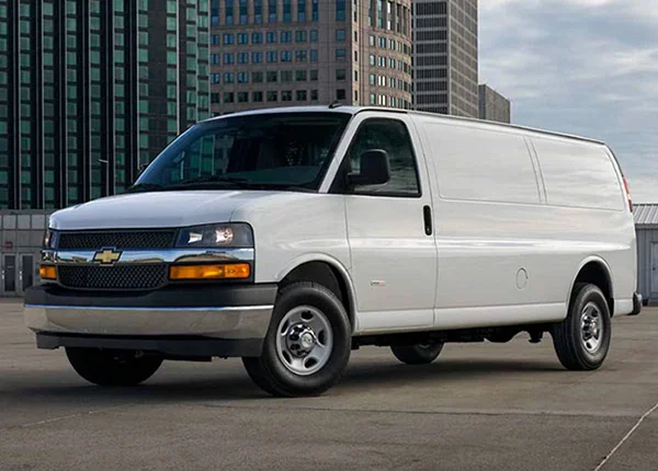 white chevy van park in parking lot