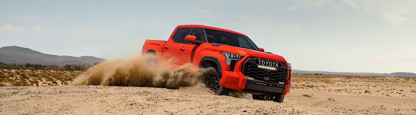 Red Toyota Tundra off roading