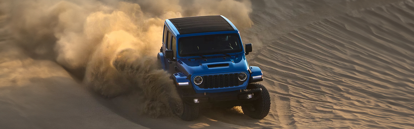 2024 Jeep Wrangler vs Ford Bronco blue top frontview