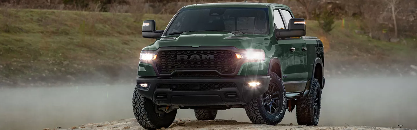 2026 RAM 1500 driving on a mountain road