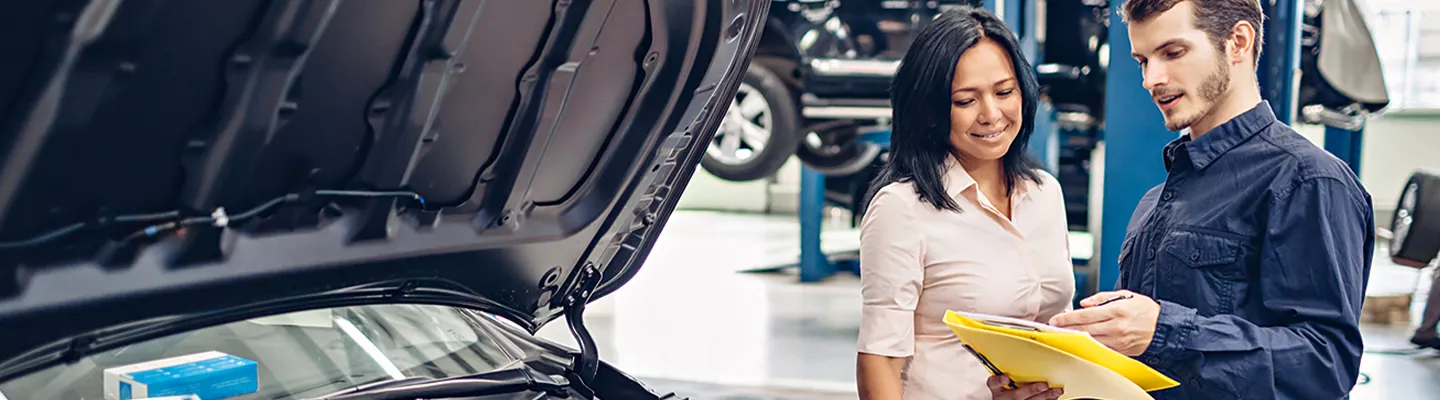 Service manager speaking with a customer at Jerry Ulm CDJR