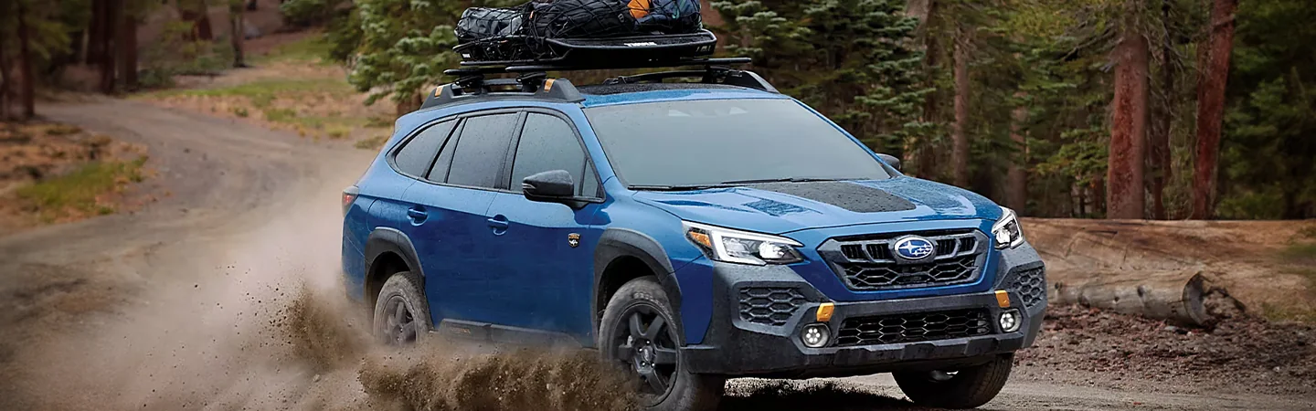 2025 Subaru Outback Touring XT driving through water