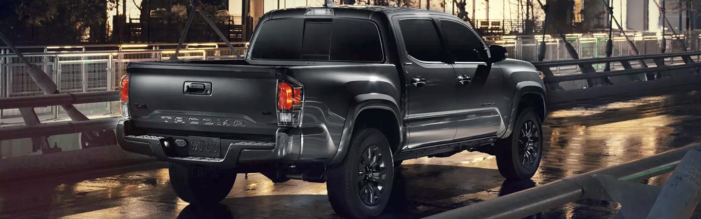 rear 3/4 view of silver black Toyota truck