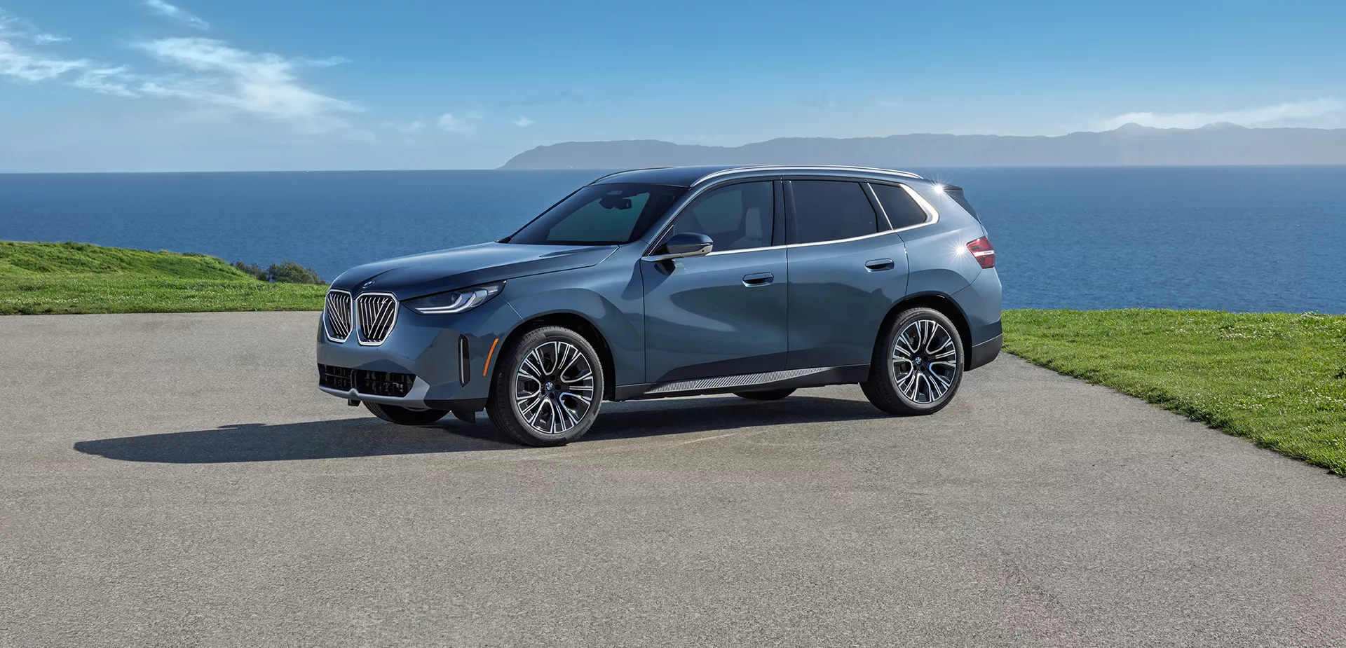 a light blue 2027 BMW X3 parked at scenic point
