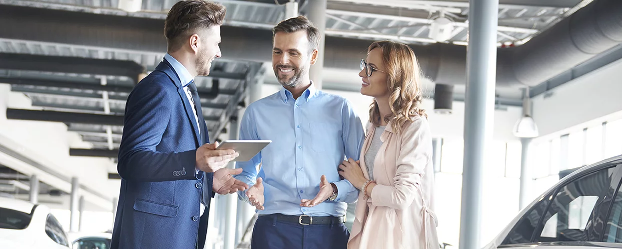 discussing vehicles at a dealership