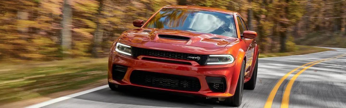 Front view of a 2022 Dodge Charger driving on a road