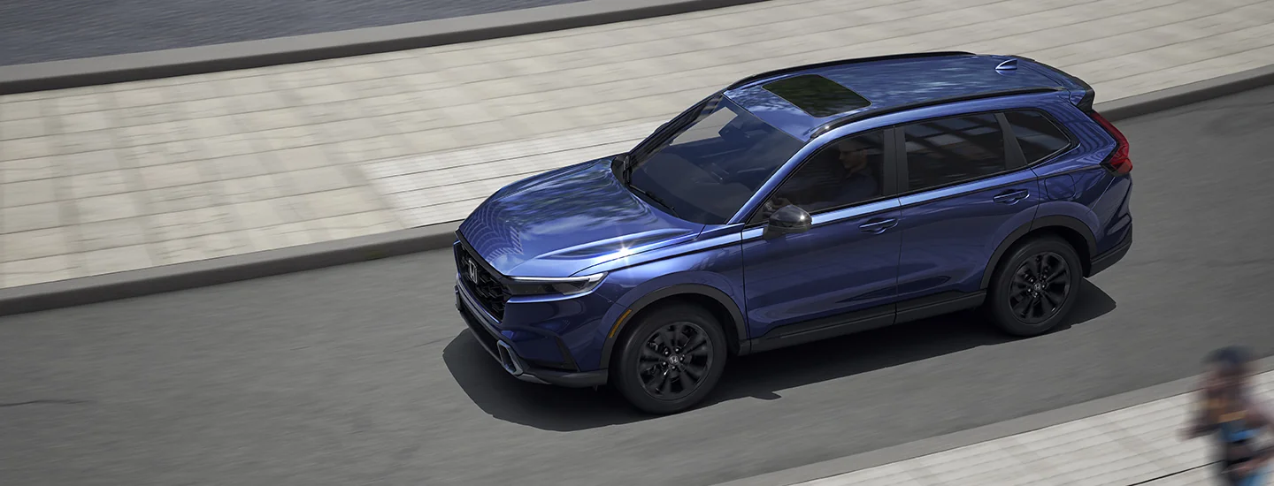 top view of a 2026 Honda CR-V Hybrid driving in the city