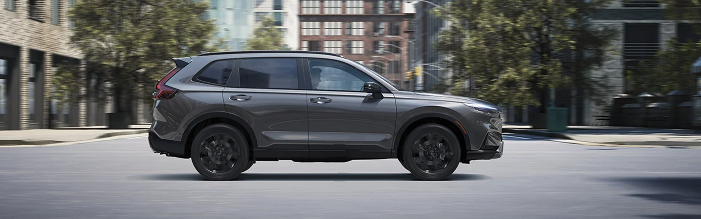 passenger side view of a silver 2026 Honda CR-V Hybrid Sport