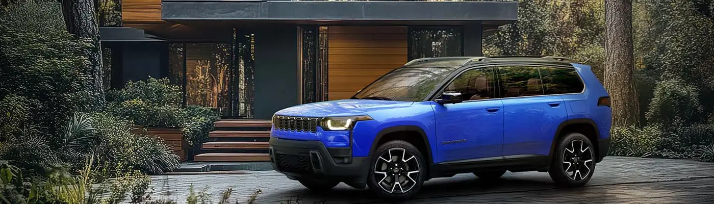 blue 2026 Jeep Cherokee in Orlando, FL parked near house