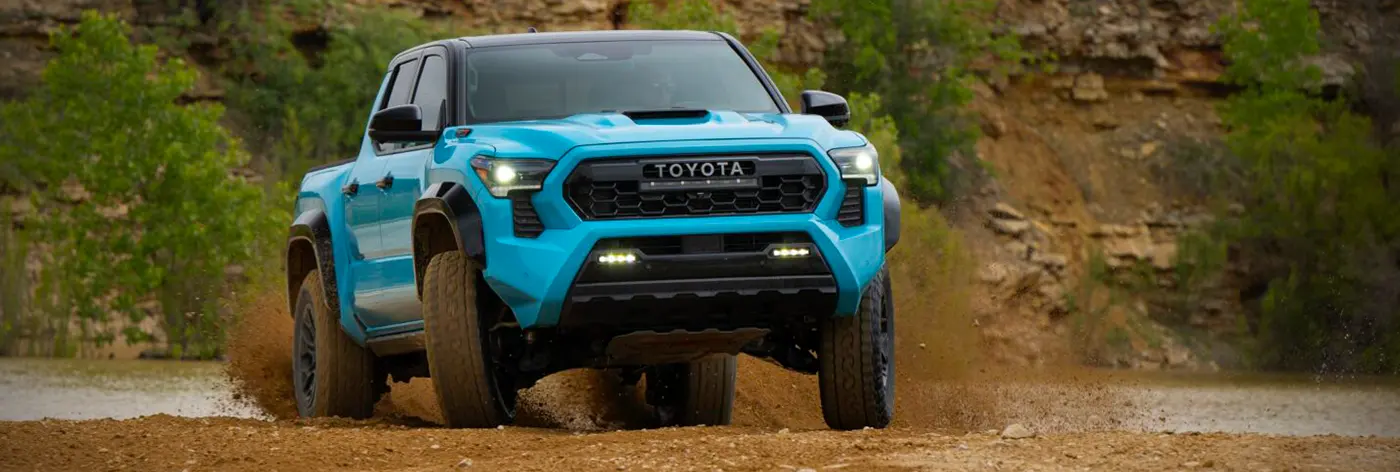 2026 Blue Toyota Tacoma in the mud