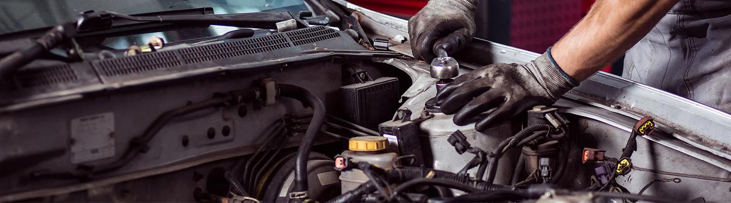 Service tech working on an engine