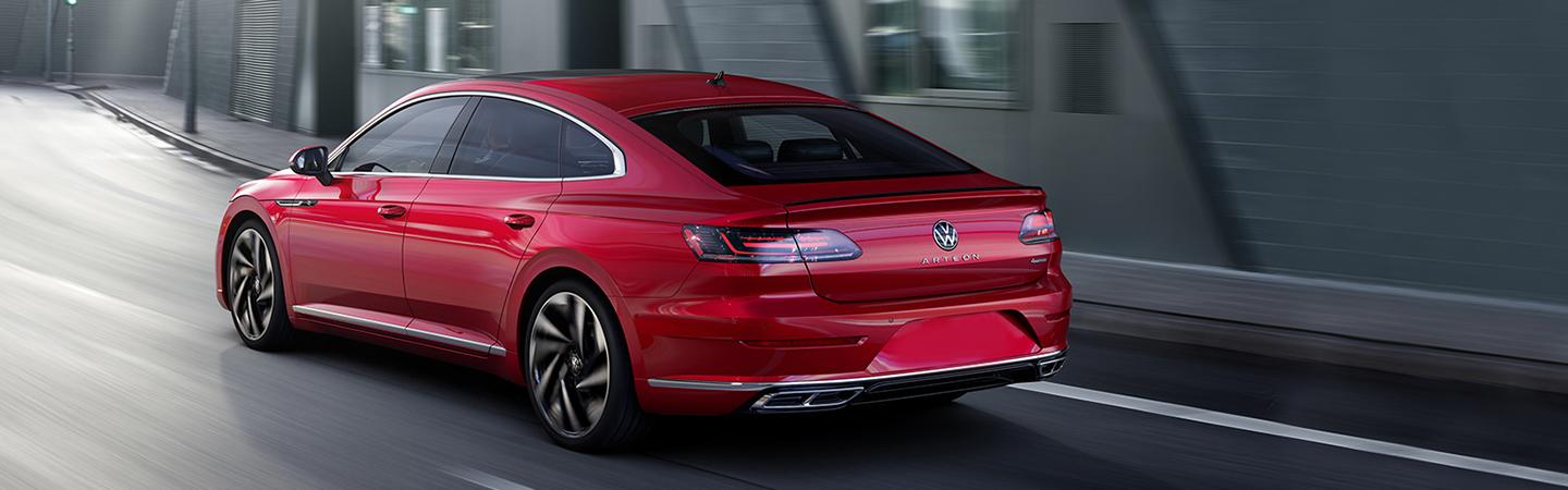 Red 2021 Volkswagen Arteon rear view in motion