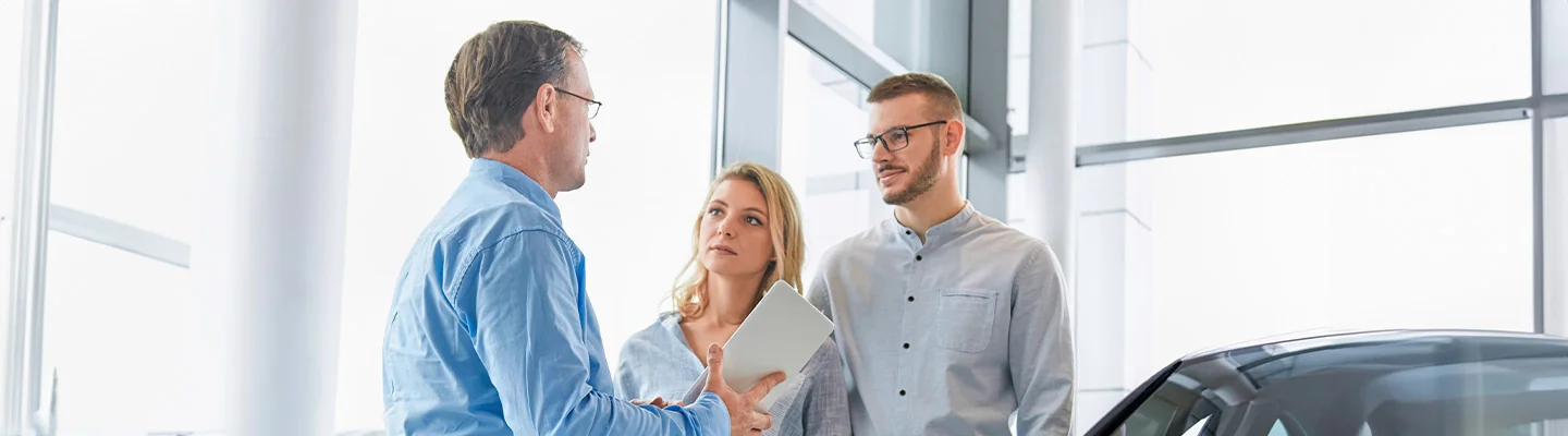 Salesman speaking to customers