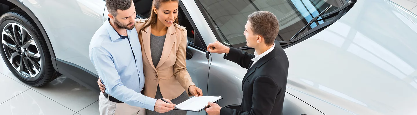 Customers trading in their vehicle at INFINITI of South Miami