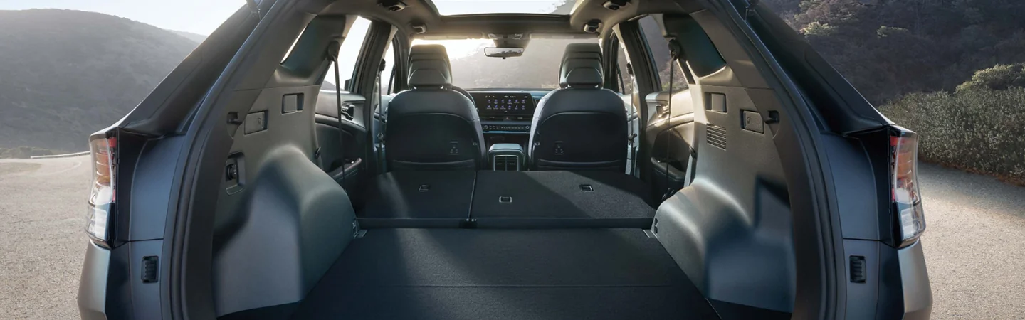 View of the trunk space with the back seat laied down of a 2025 Kia Sportage
