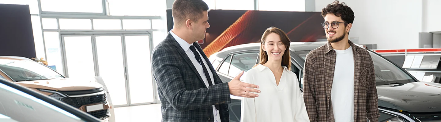 Sales person talking to customers about there trade in