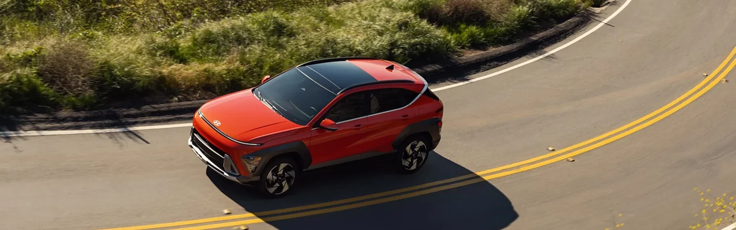 2025 Hyundai Kona driving on a curve