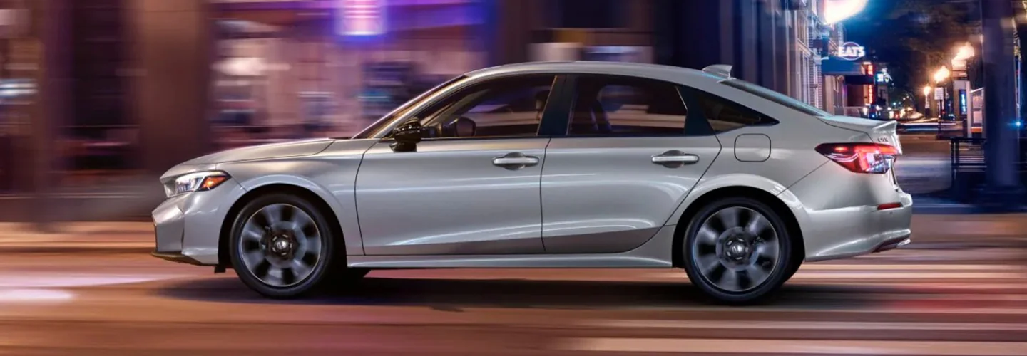 silver Honda driving at night
