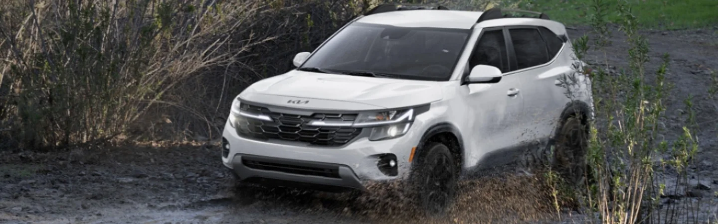 Kia Seltos driving through stream