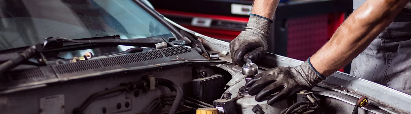 mechanic working on engine