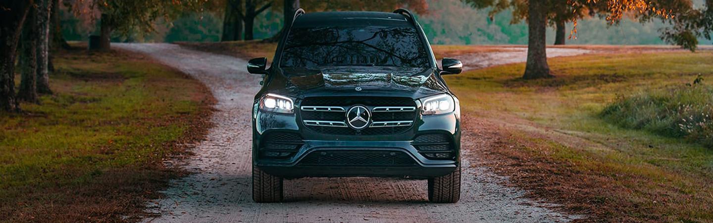 Front View 2022 Mercedes-Benz GLS driving down dirt road