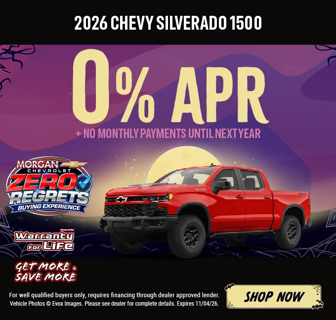 2026 Chevy Silverado 1500 – 0% APR plus no monthly payments until next year. Red Chevrolet Silverado pickup with the Chevy bowtie logo, shown against a Halloween night background with a full moon. Includes a "Home of the Warranty for Life" logo and a "Get More & Save More" badge. For well-qualified buyers only; requires financing through a dealer-approved lender. Vehicle photos © Evox Images. Please see dealer for complete details. Expires 11/04/26. Shop Now.