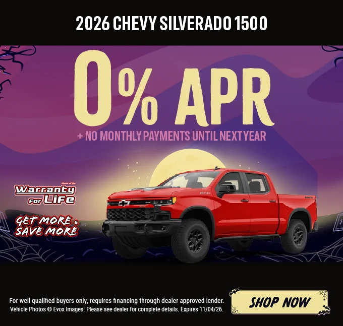 2026 Chevy Silverado 1500 – 0% APR plus no monthly payments until next year. Red Chevrolet Silverado pickup with the Chevy bowtie logo, shown against a Halloween night background with a full moon. Includes a "Home of the Warranty for Life" logo and a "Get More & Save More" badge. For well-qualified buyers only; requires financing through a dealer-approved lender. Vehicle photos © Evox Images. Please see dealer for complete details. Expires 11/04/26. Shop Now.
