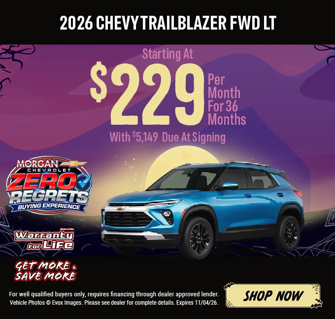 2026 Chevy Trailblazer FWD LT – Starting at $229 per month for 36 months with $5,149 due at signing. Blue Chevrolet Trailblazer SUV with the Chevy bowtie logo, shown against a Halloween night background with a full moon. Includes a "Home of the Warranty for Life" logo and a "Get More & Save More" badge. For well-qualified buyers only; requires financing through a dealer-approved lender. Vehicle photos © Evox Images. Please see dealer for complete details. Expires 11/04/26. Shop Now.
