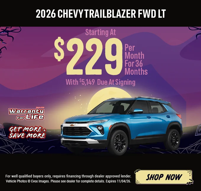 2026 Chevy Trailblazer FWD LT – Starting at $229 per month for 36 months with $5,149 due at signing. Blue Chevrolet Trailblazer SUV with the Chevy bowtie logo, shown against a Halloween night background with a full moon. Includes a "Home of the Warranty for Life" logo and a "Get More & Save More" badge. For well-qualified buyers only; requires financing through a dealer-approved lender. Vehicle photos © Evox Images. Please see dealer for complete details. Expires 11/04/26. Shop Now.