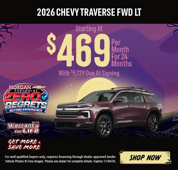 2026 Chevy Traverse FWD LT – Starting at $469 per month for 24 months with $9,729 due at signing. Dark maroon Chevrolet Traverse SUV with the Chevy bowtie logo, shown against a Halloween night background with a full moon. Includes a "Home of the Warranty for Life" logo and a "Get More & Save More" badge. For well-qualified buyers only; requires financing through a dealer-approved lender. Vehicle photos © Evox Images. Please see dealer for complete details. Expires 11/04/26. Shop Now.