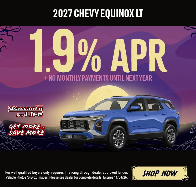 2027 Chevy Equinox LT – 1.9% APR plus no monthly payments until next year. Blue Chevrolet Equinox SUV with the Chevy bowtie logo, shown against a Halloween night background with a full moon. Includes a "Home of the Warranty for Life" logo and a "Get More & Save More" badge. For well-qualified buyers only; requires financing through a dealer-approved lender. Vehicle photos © Evox Images. Please see dealer for complete details. Expires 11/04/26. Shop Now.