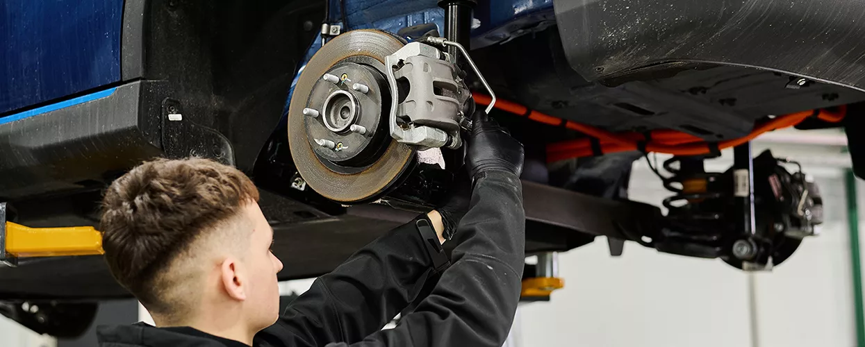 Service mechanic working on a vehicles brakes