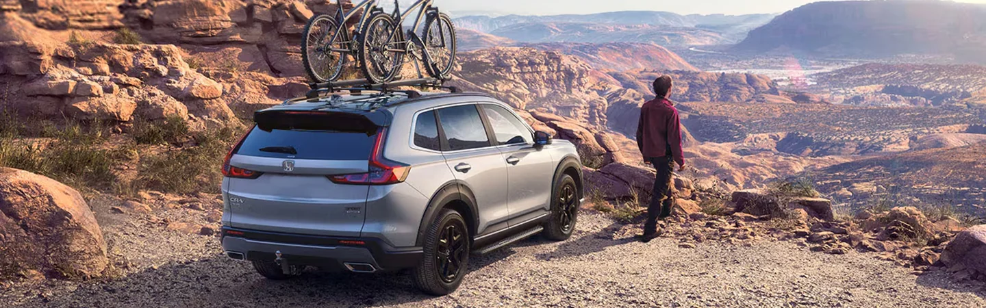 2025 Honda CR-V parked at scenic overlook with bike on roof rack
