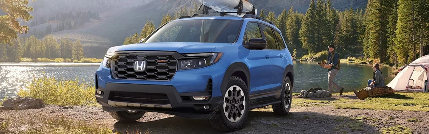 Honda Passport rear view driving up parking garage