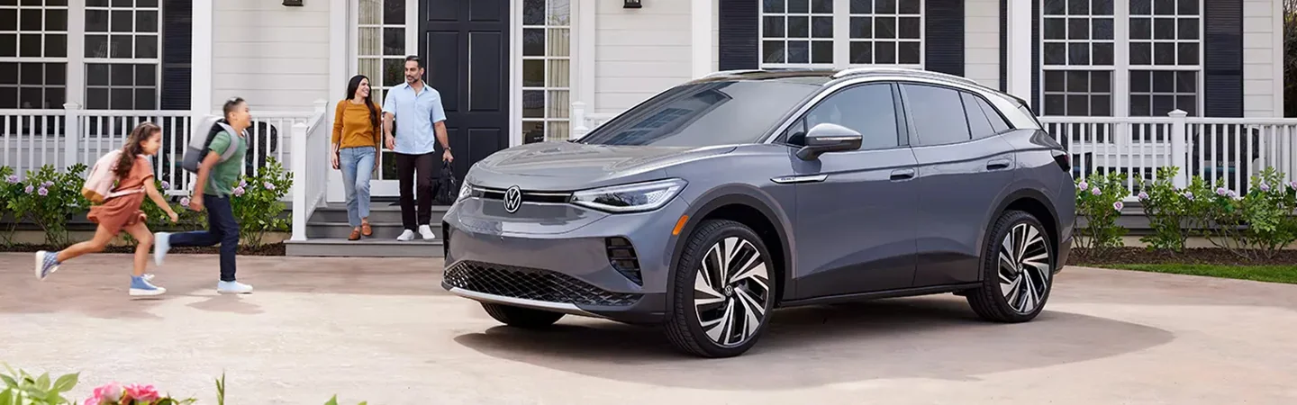 Side view of a parked 2024 Volkswagen ID.4 in a driveway