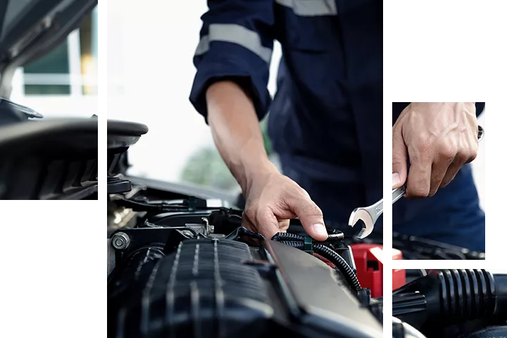 Service technician working under the hood of a vehicle