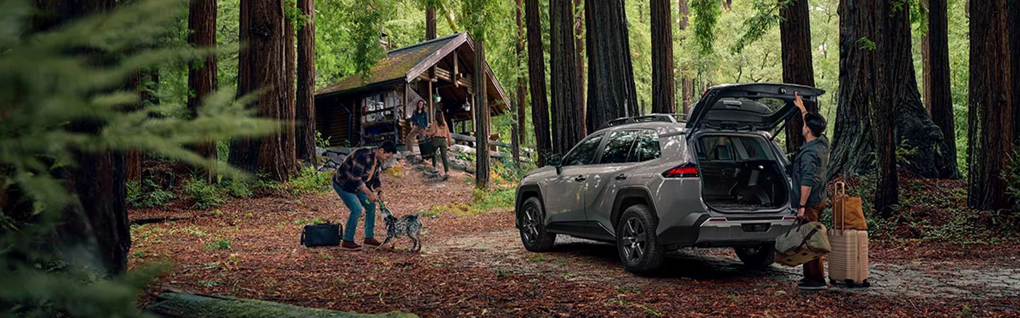 2026 Toyota RAV4 parked at a campground and people unloading gear from the back in Holiday, FL