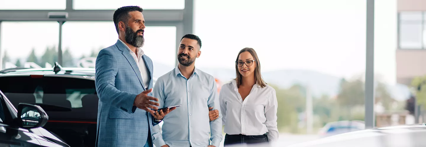 Car salesperson speaking with customer about financing options